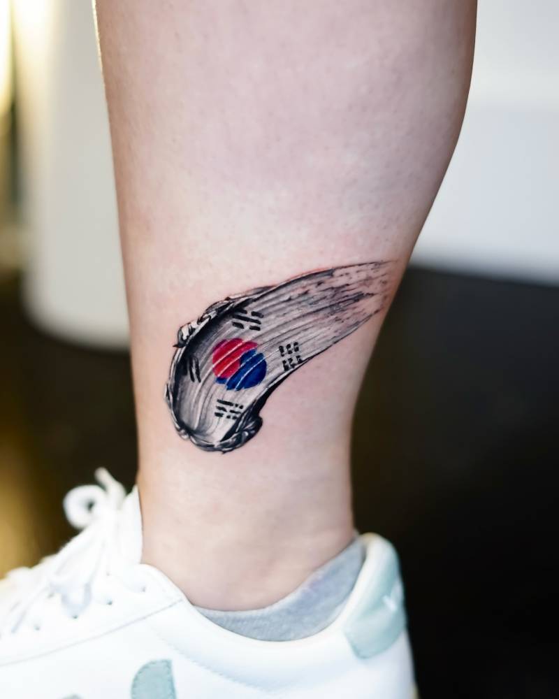 Flag of South Korea brush stroke tattoo located on the ankle.