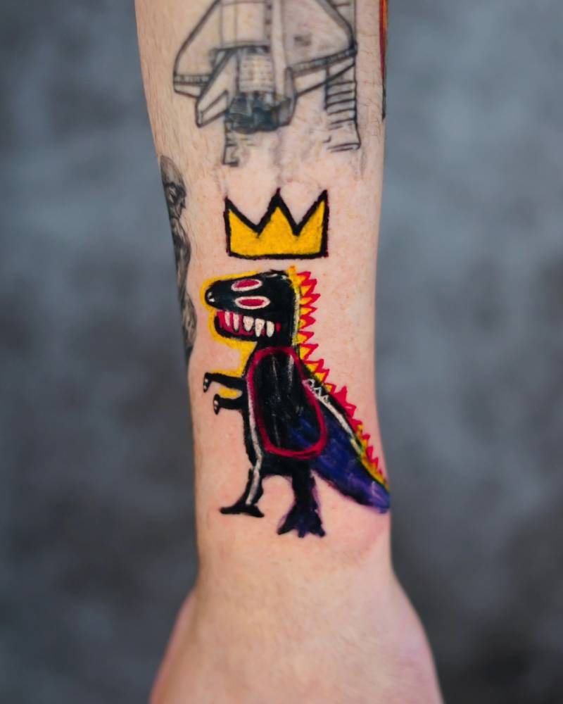 'Life Doesn't Frighten Me T-Rex' tattoo located on the thigh.