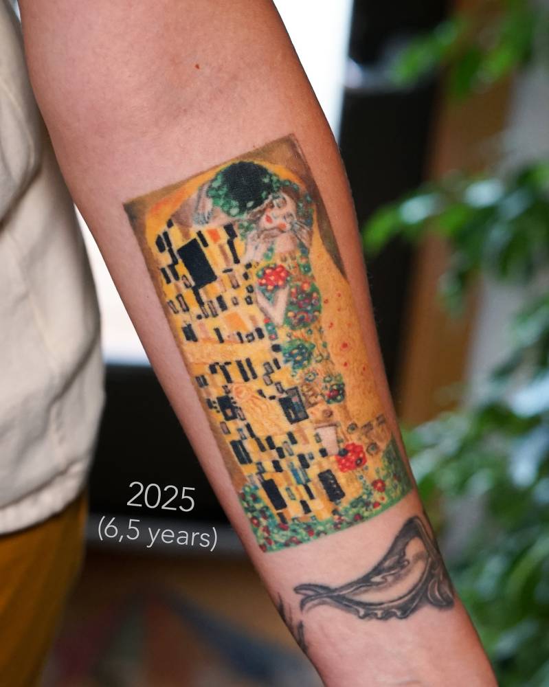 'The Kiss' tattoo located on the inner forearm, 6 and half years healed.