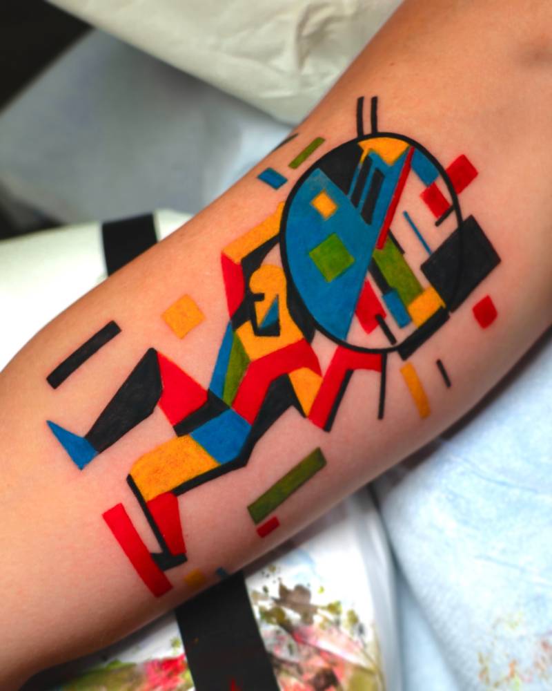 Pop art style Atlas tattoo located on the inner arm.