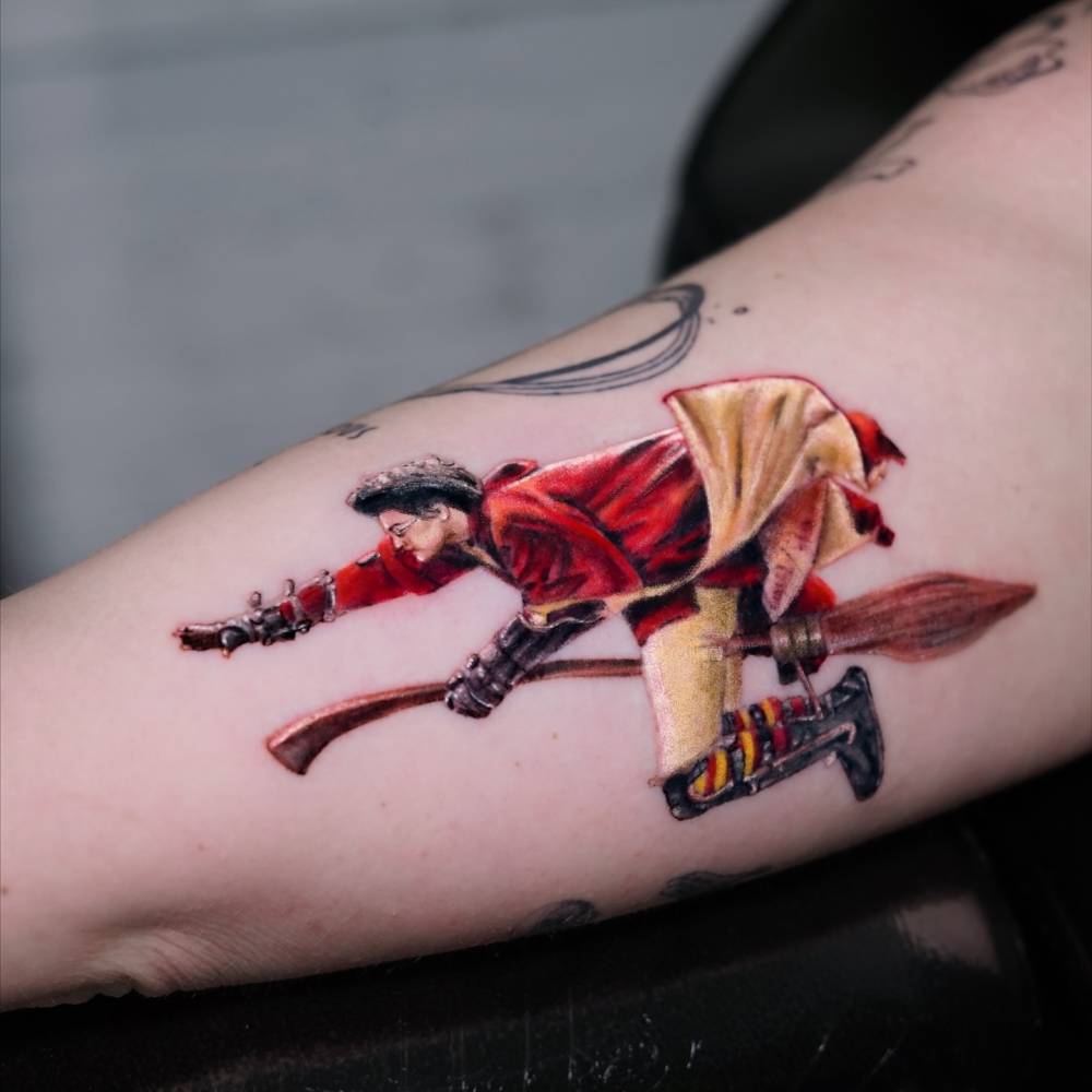 Harry Potter tattoo located on the inner arm, watercolor style.
