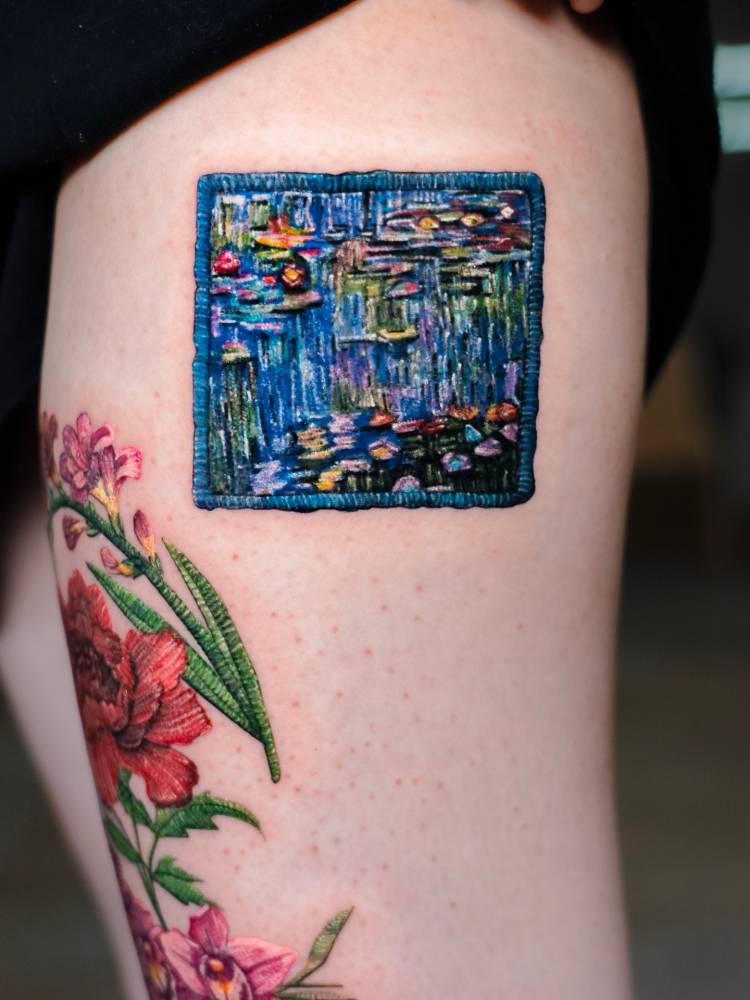 'Water Lilies' patch tattoo in embroidery style located on the thigh.