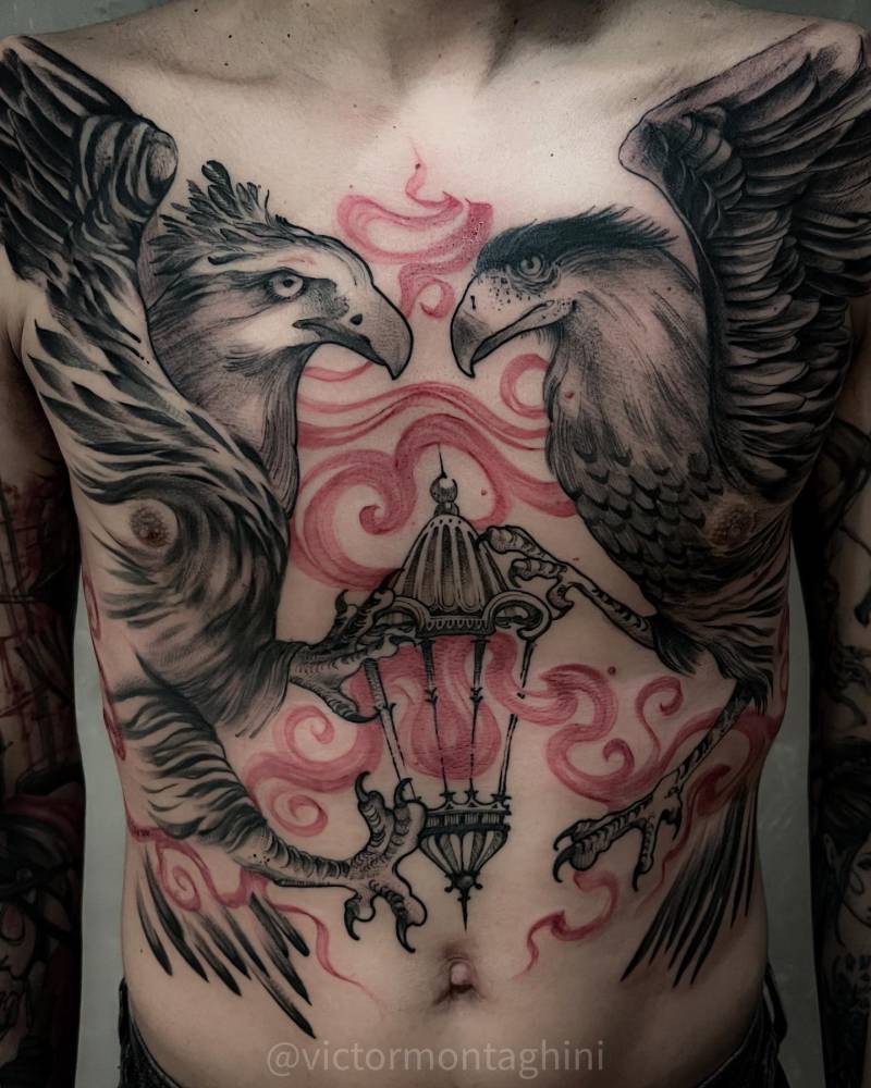 Eagles and lantern tattoo in sketch work style located on the torso.