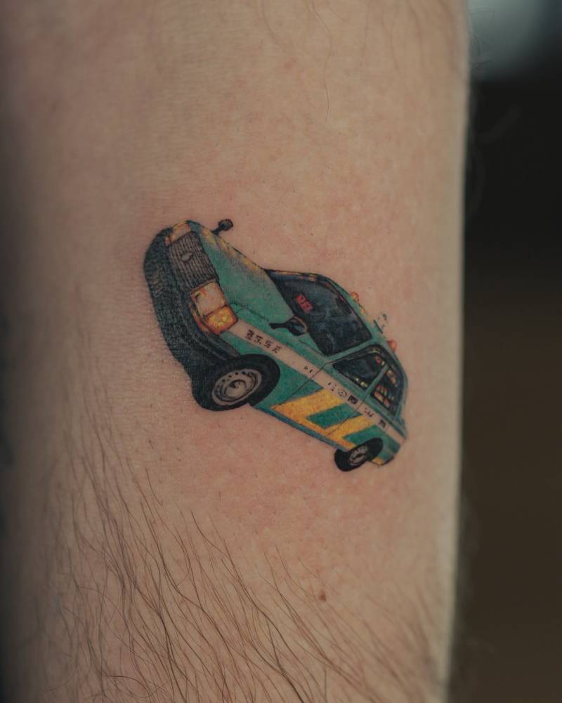 Tokyo taxi tattoo in micro-realistic style located on the inner forearm.
