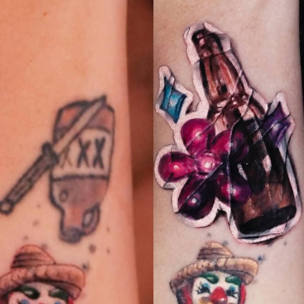 Bootle and flower sticker cover up tattoo located on the wrist.