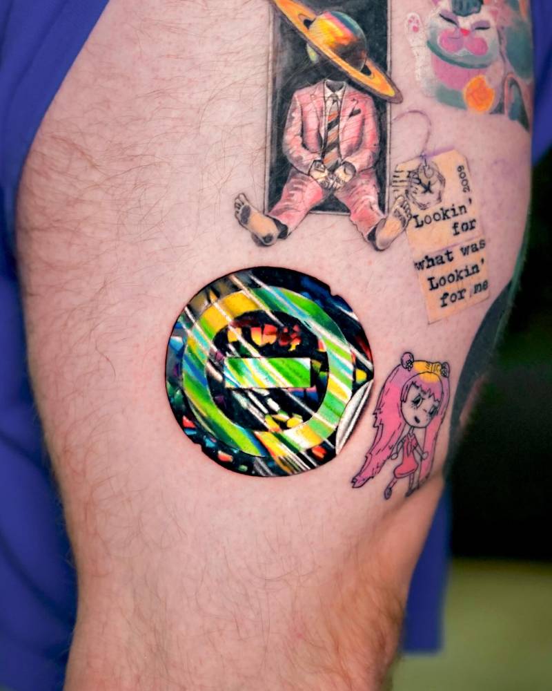 Holographic sticker tattoo located on the thigh.