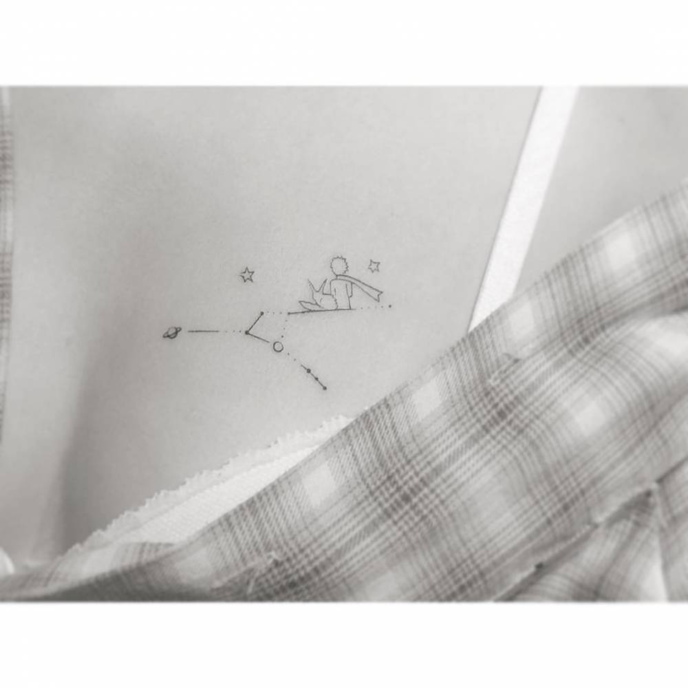 The Little Prince tattoo in fine line style done on the chest.