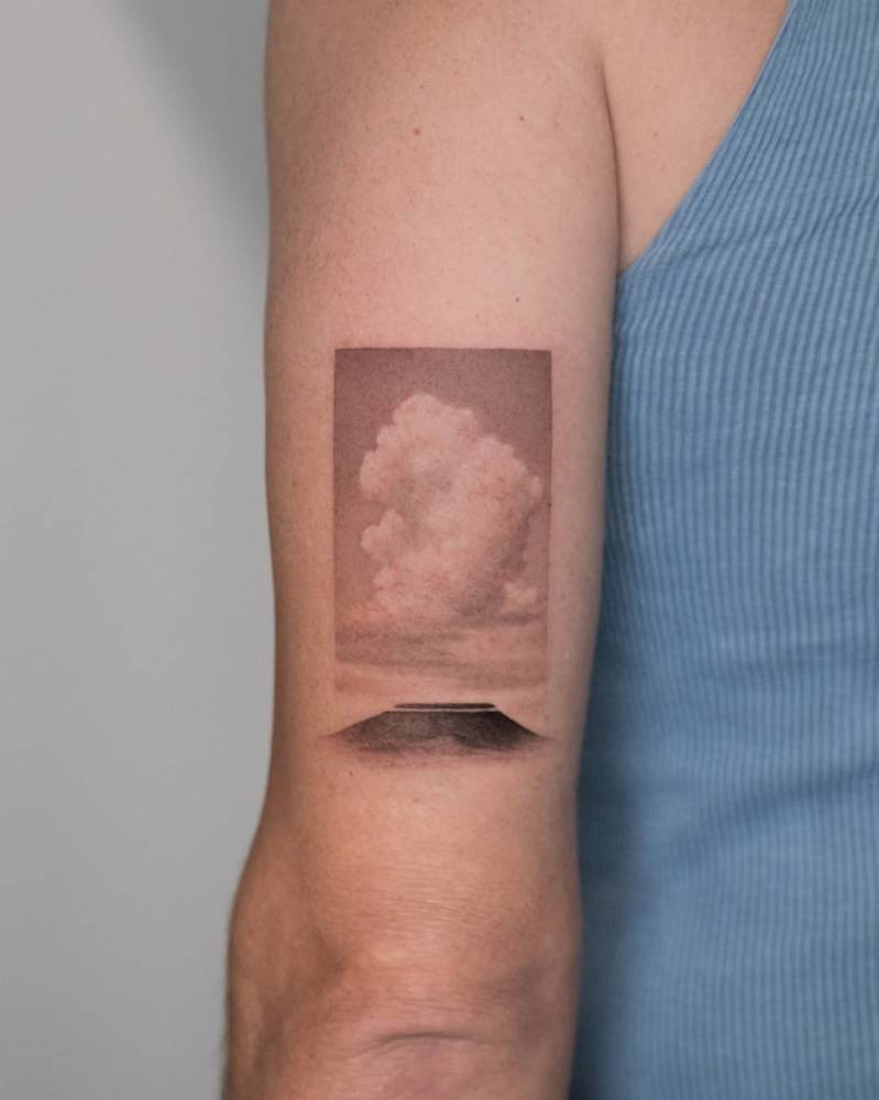 Floating Mesa tattoo located on the tricep, done in micro-realism.