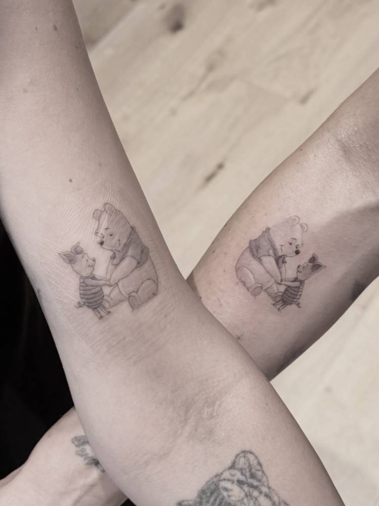 Matching Pooh Bear and Piglet tattoo for best friends.