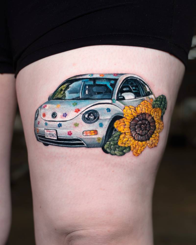 Volkswagen New Beetle 2001 with crochet sunflower tattooed on the thigh.