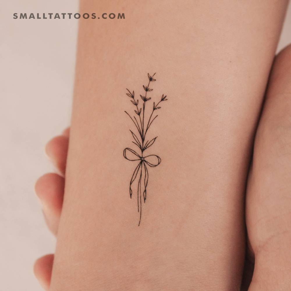 Ribbon flower bouquet temporary tattoo located on the wrist.