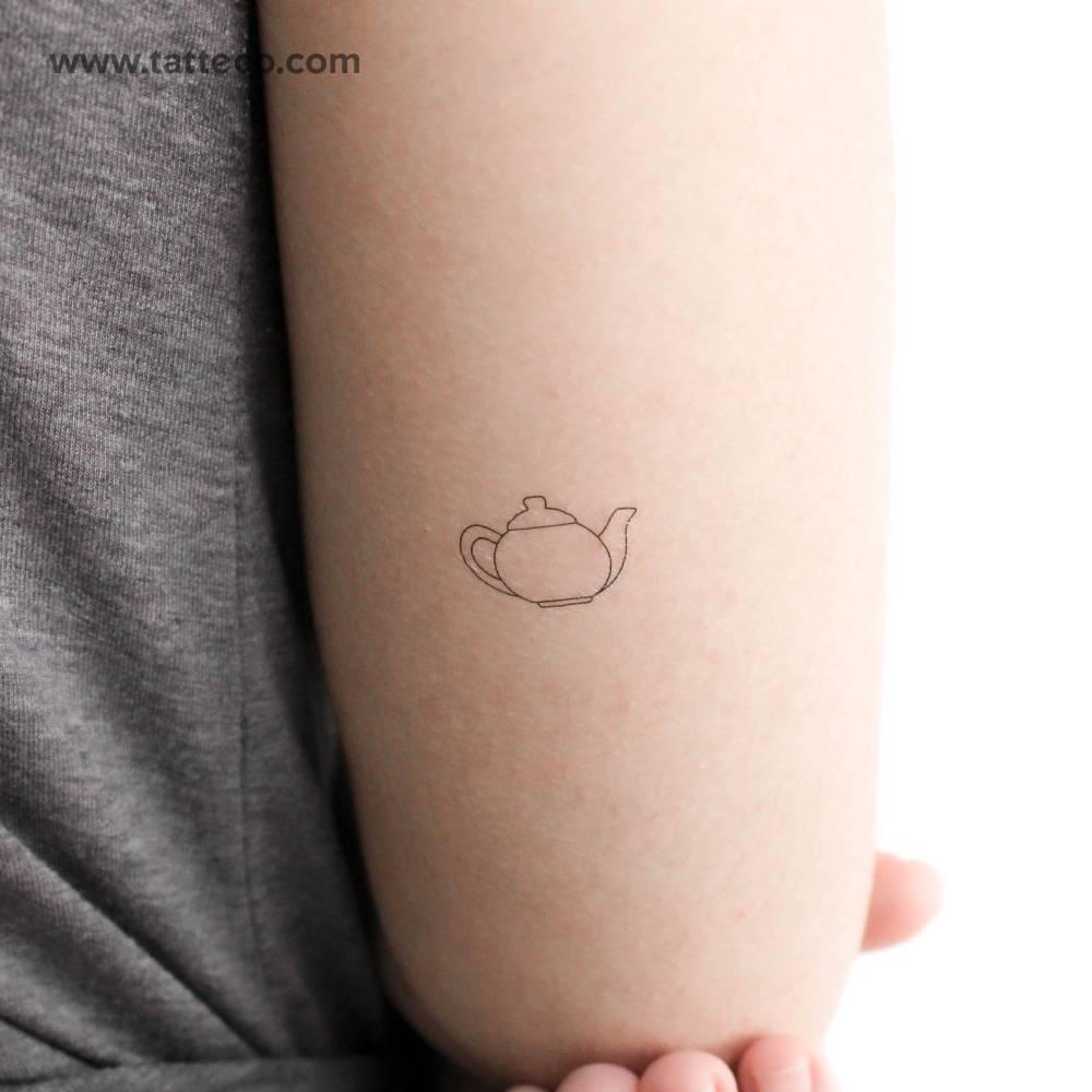 Fine line teapot temporary tattoo located on the tricep.