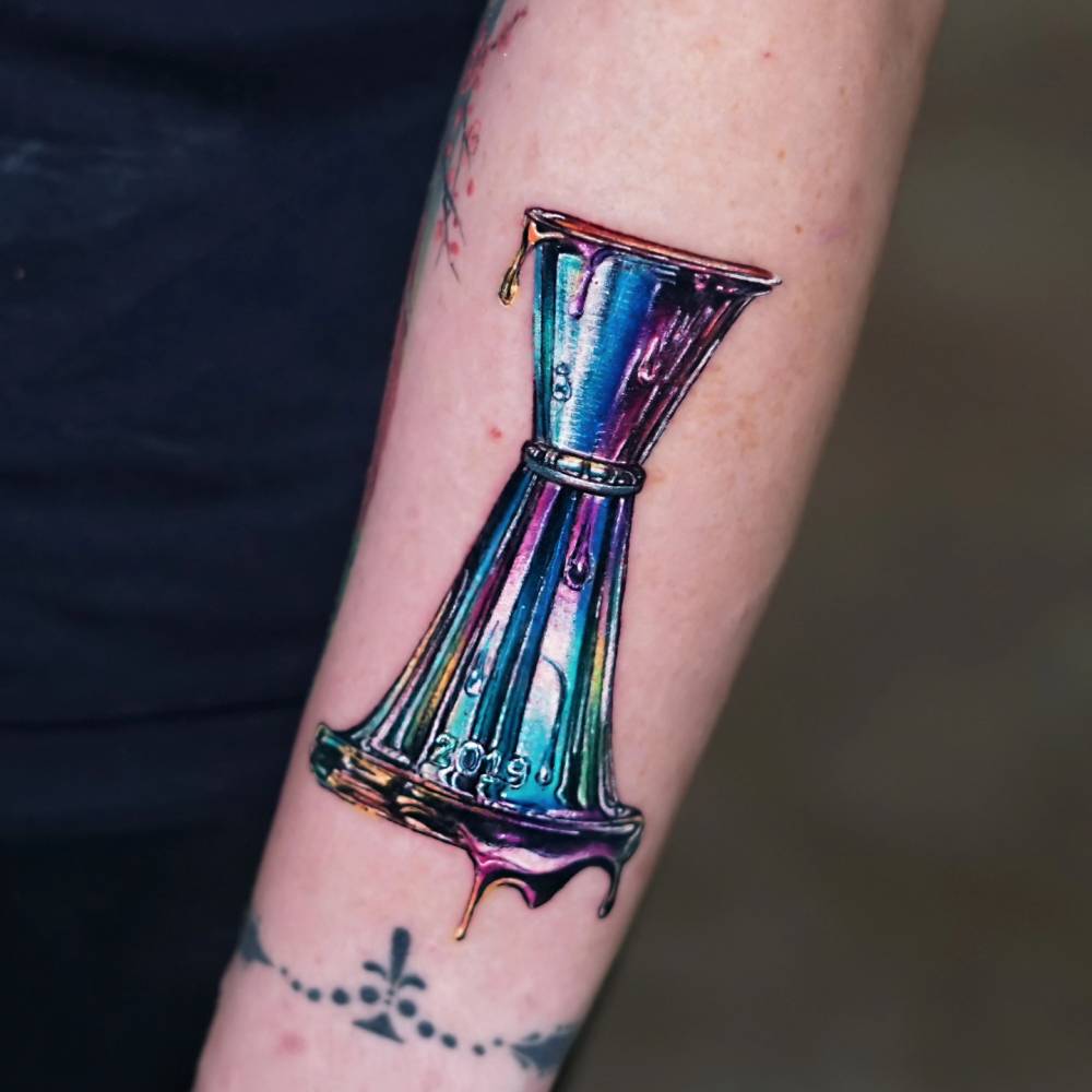 Bartender tool "Jigger" tattooed on the forearm.