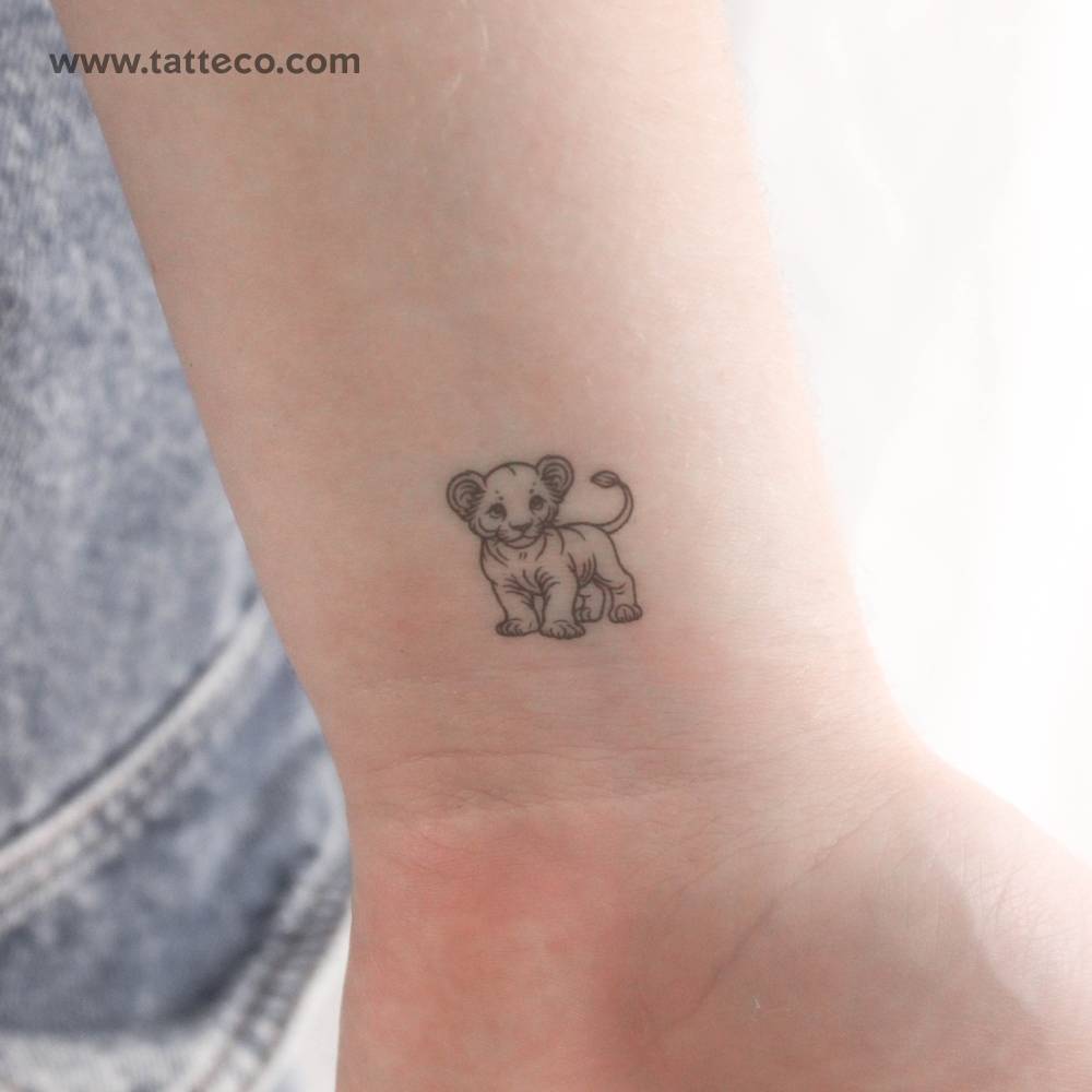 Little lion cub temporary tattoo located on the wrist.