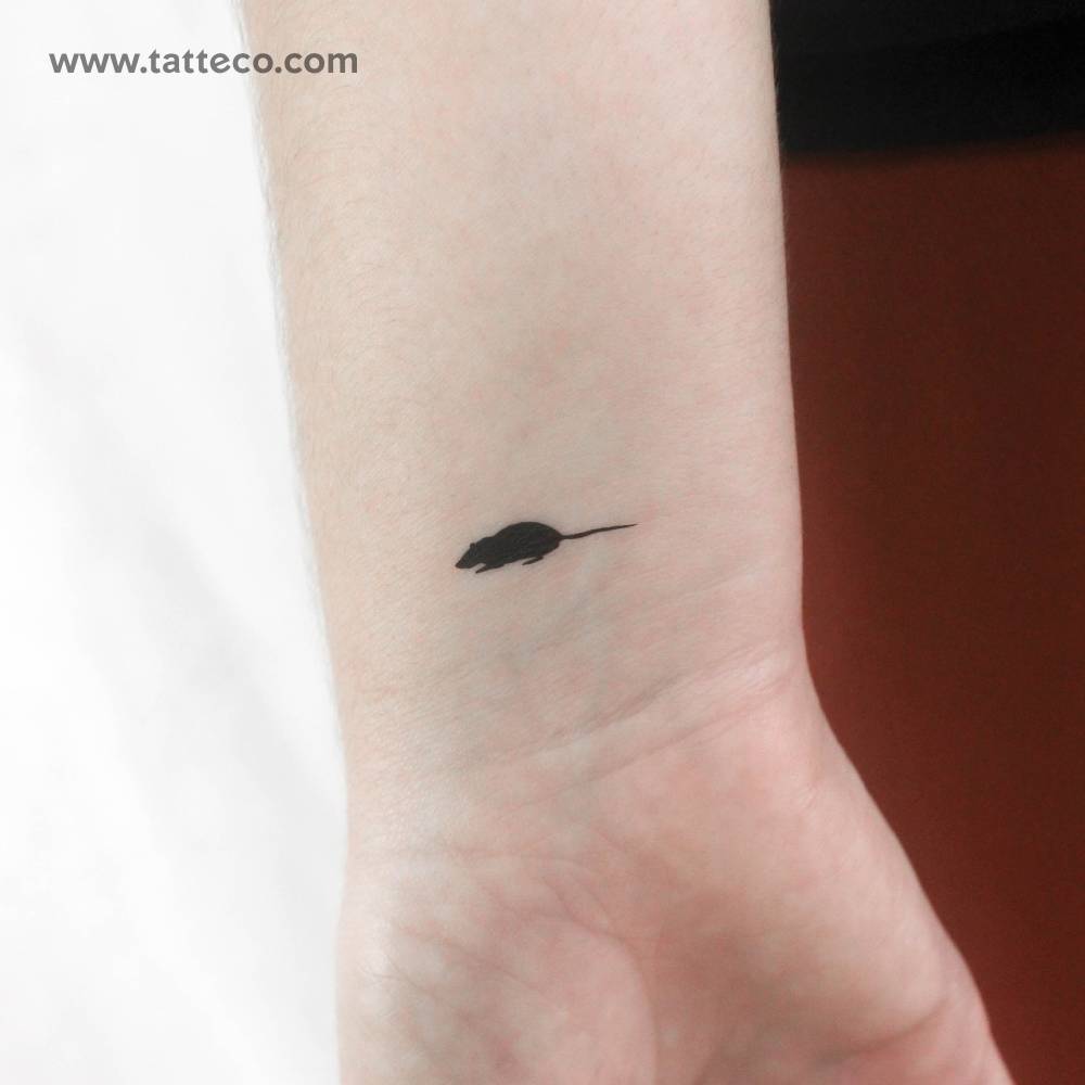 Black rat temporary tattoo located on the wrist.