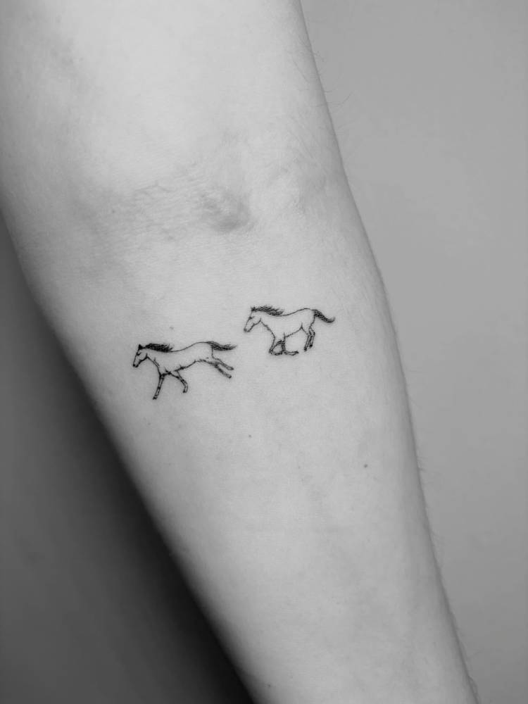 Single needle mini horses tattoo placed on the inner forearm.