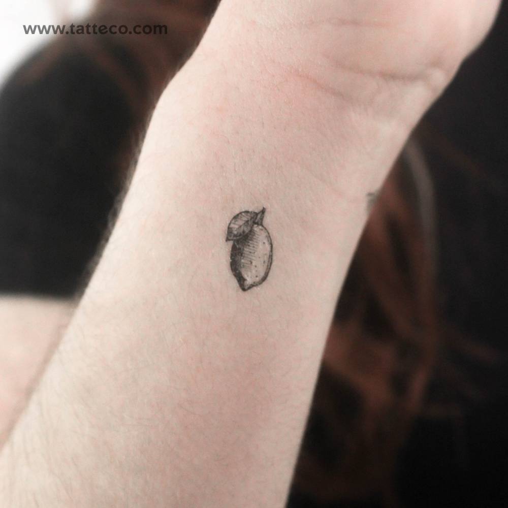 Little lemon temporary tattoo in engraving style.