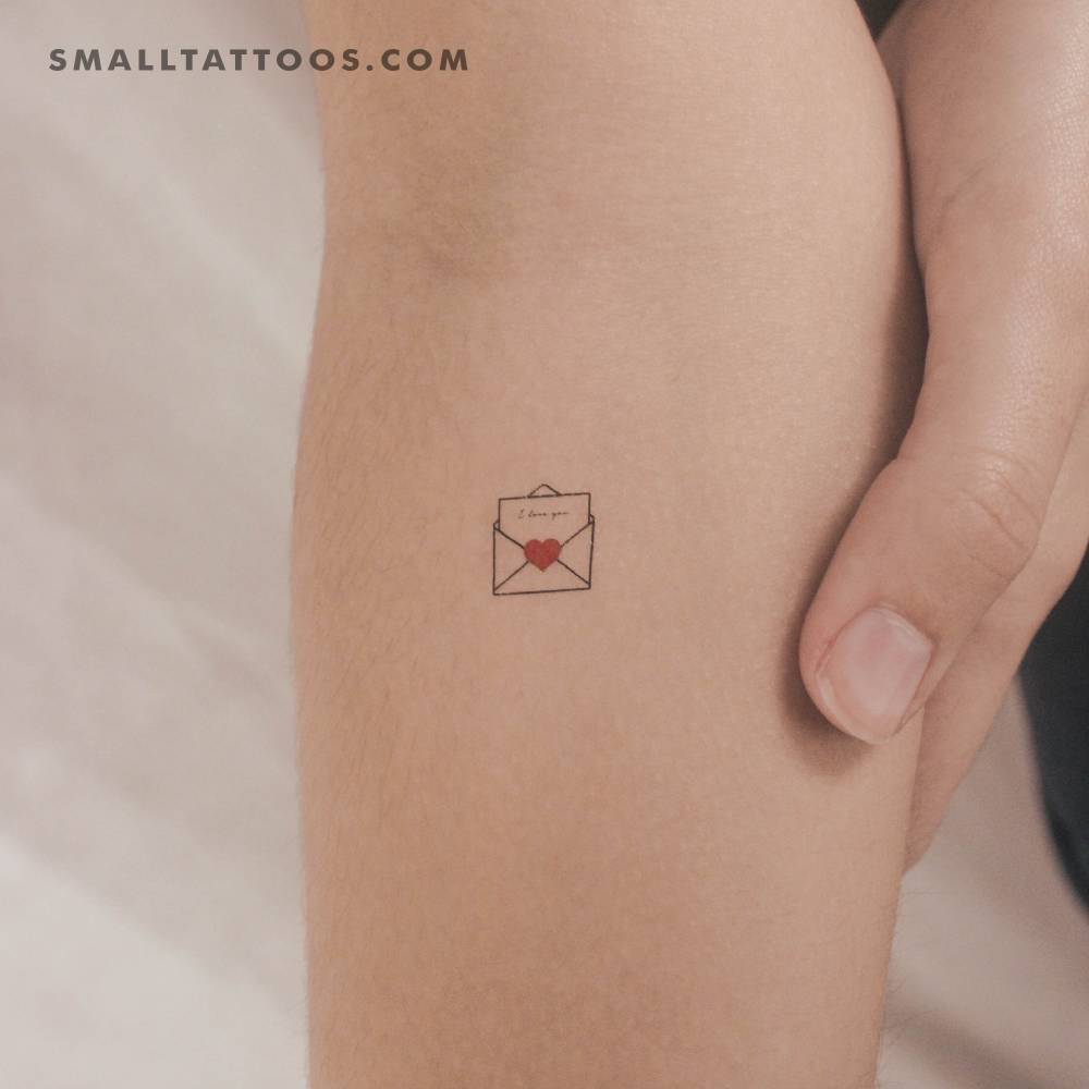 Open love letter temporary tattoo placed on the inner forearm.