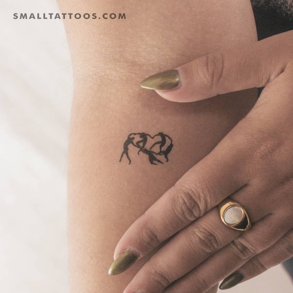 Matisse's 'Dance' temporary tattoo located on the inner forearm.