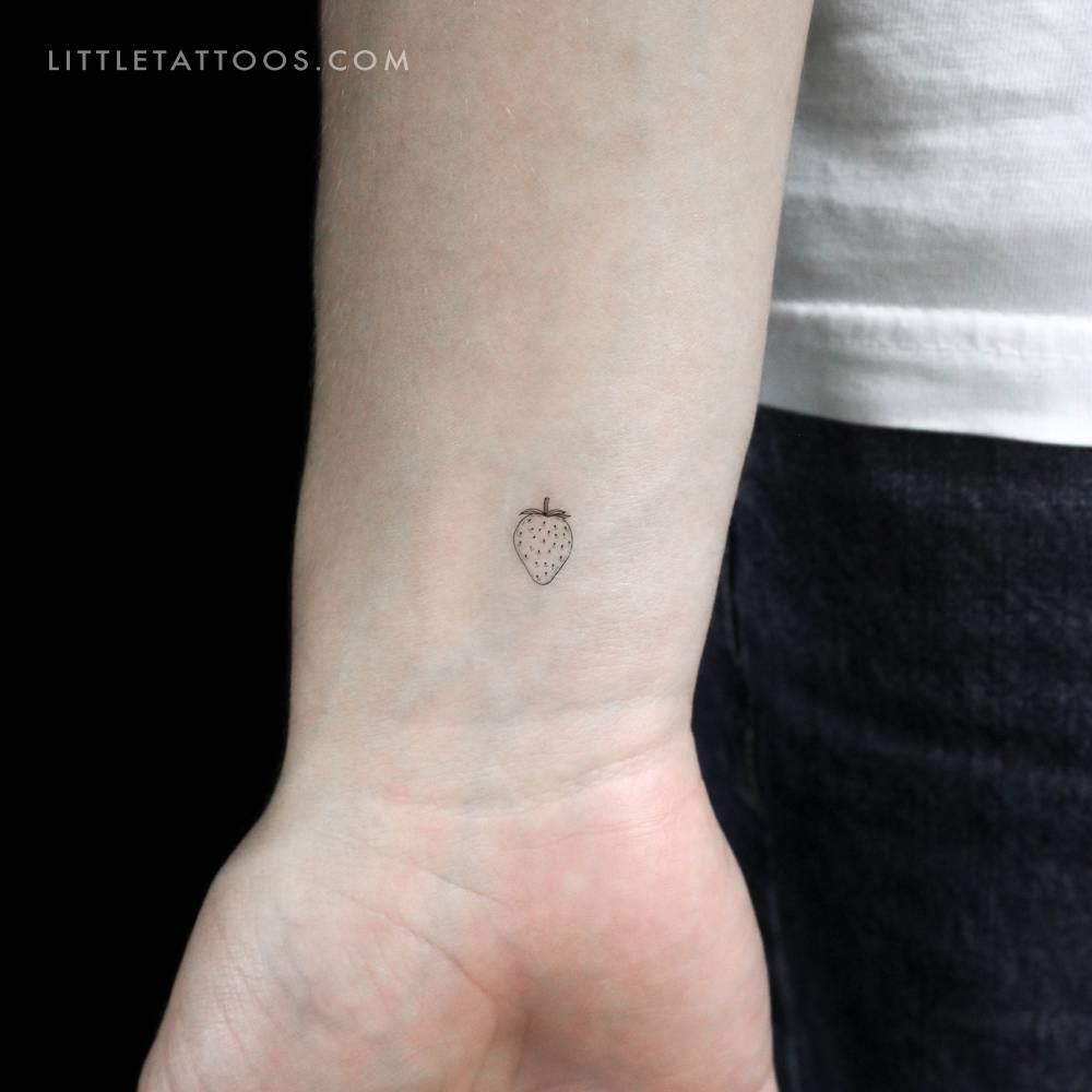 Fine line style little strawberry temporary tattoo.