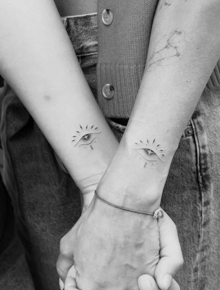 Matching ornamental evil eye tattoo for Jessica Alba and her daughter.