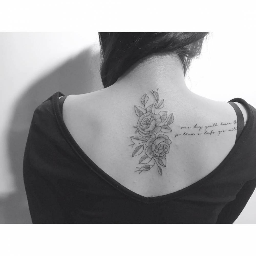 Illustrative style rose heads tattoo located on the upper BACK.