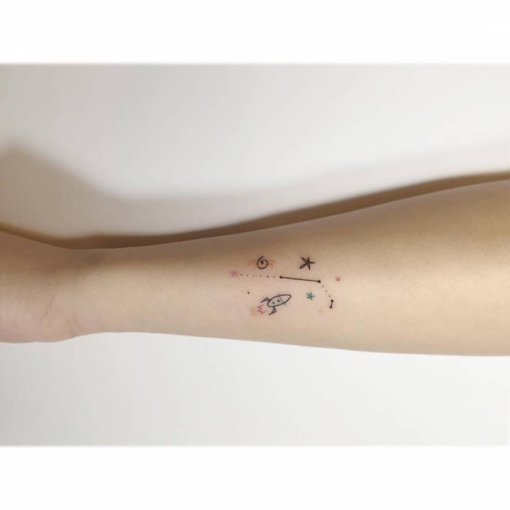 Aries constellation and galaxy tattoo located on the forearm.