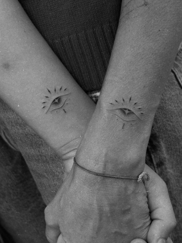Matching ornamental evil eye tattoo for Jessica Alba and her daughter.