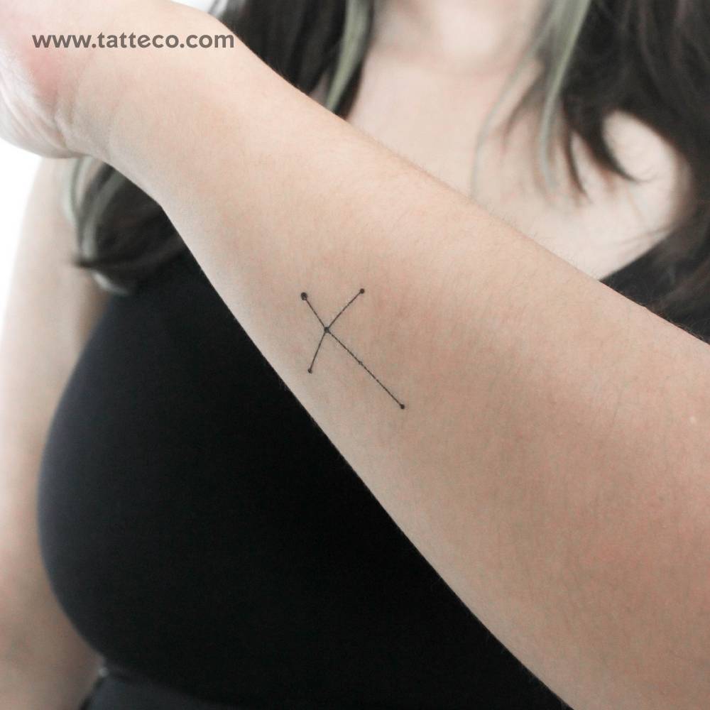 Northern cross temporary tattoo located on the wrist.