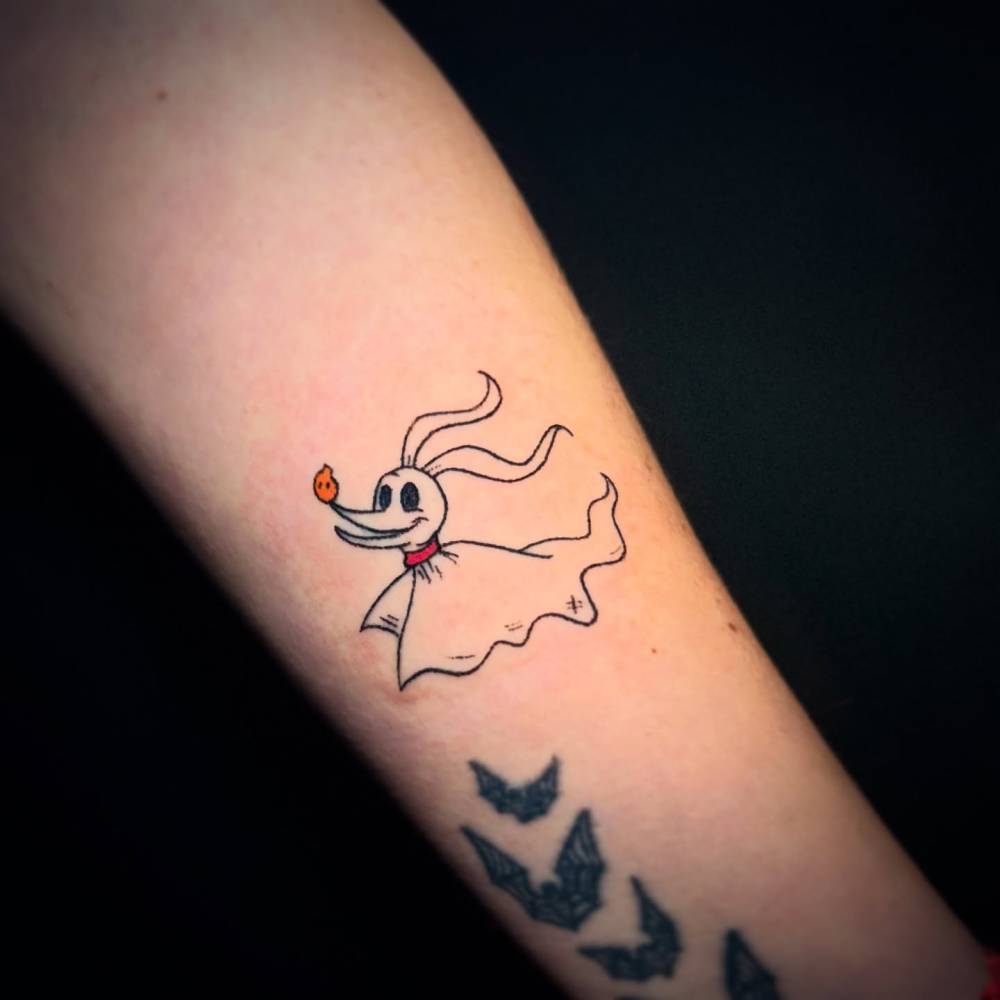 Zero from 'The Nightmare Before Christmas' tattooed on the inner forearm.