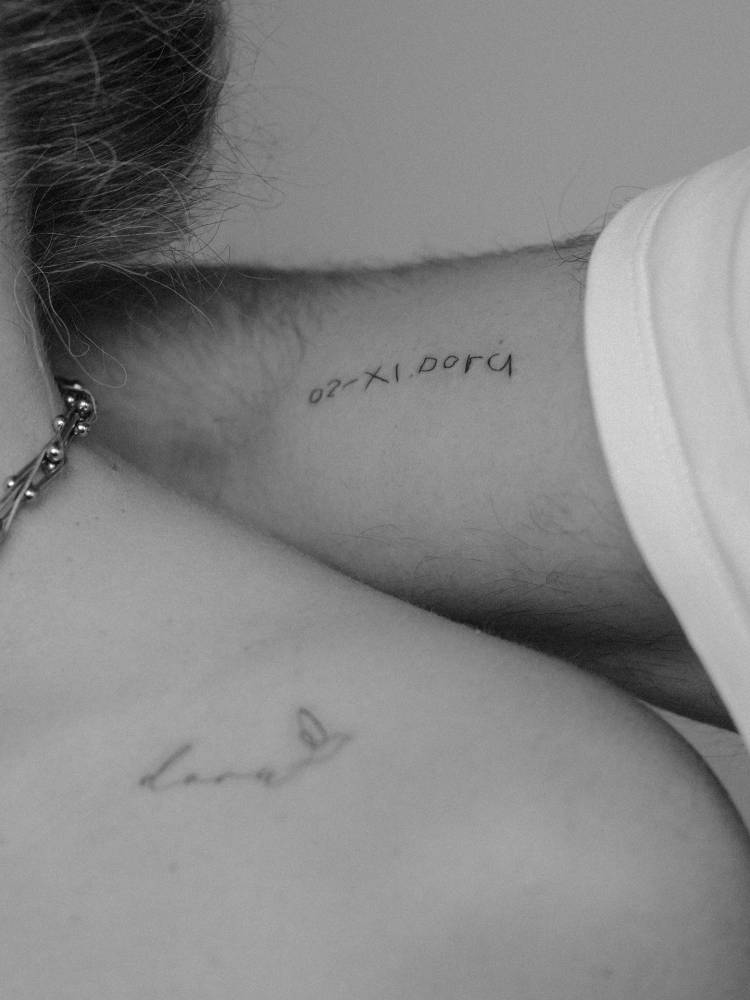 Child's handwriting tattooed on the bicep.