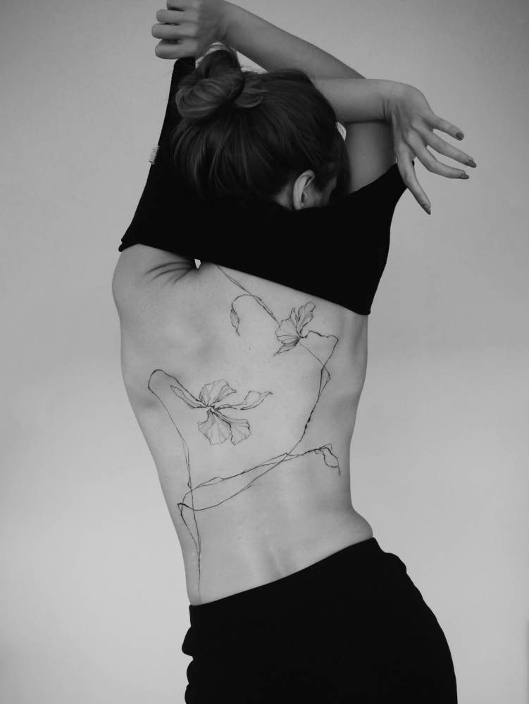 Floral design in illustrative style located on the back.