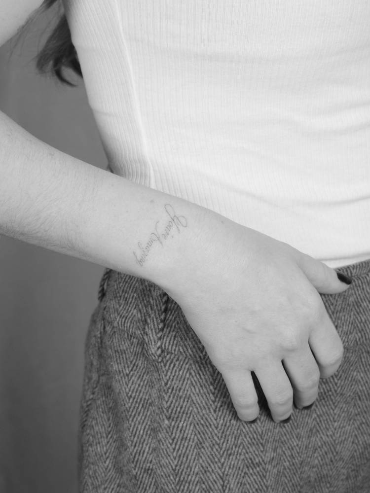 “You're amazing” lettering tattoo placed on the wrist.