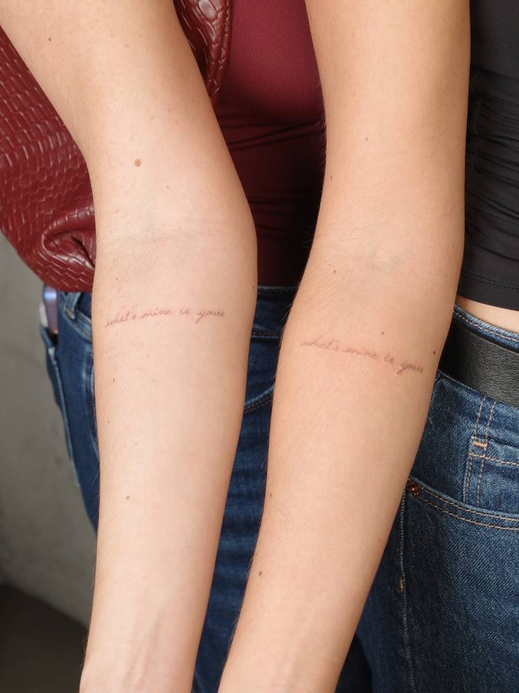 "What's mine is yours" matching lettering tattoo for sisters.