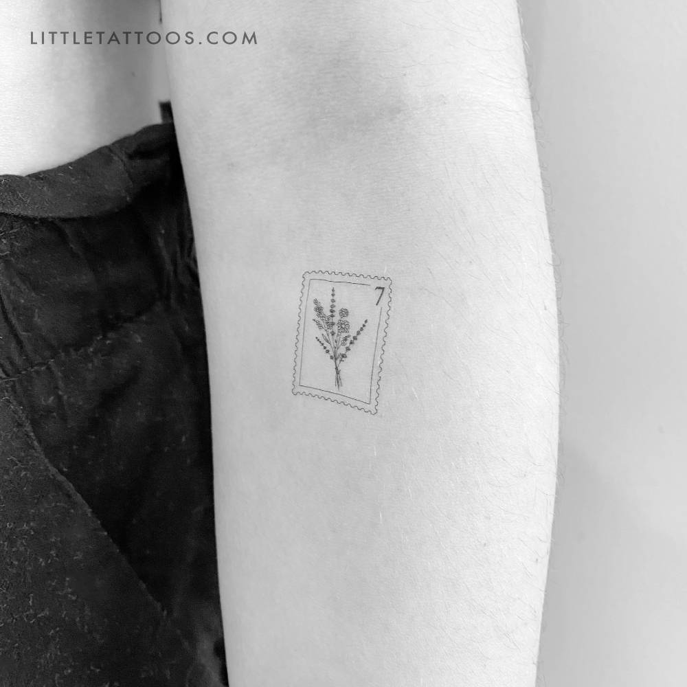 Flower bouquet stamp temporary tattoo located on the inner forearm.