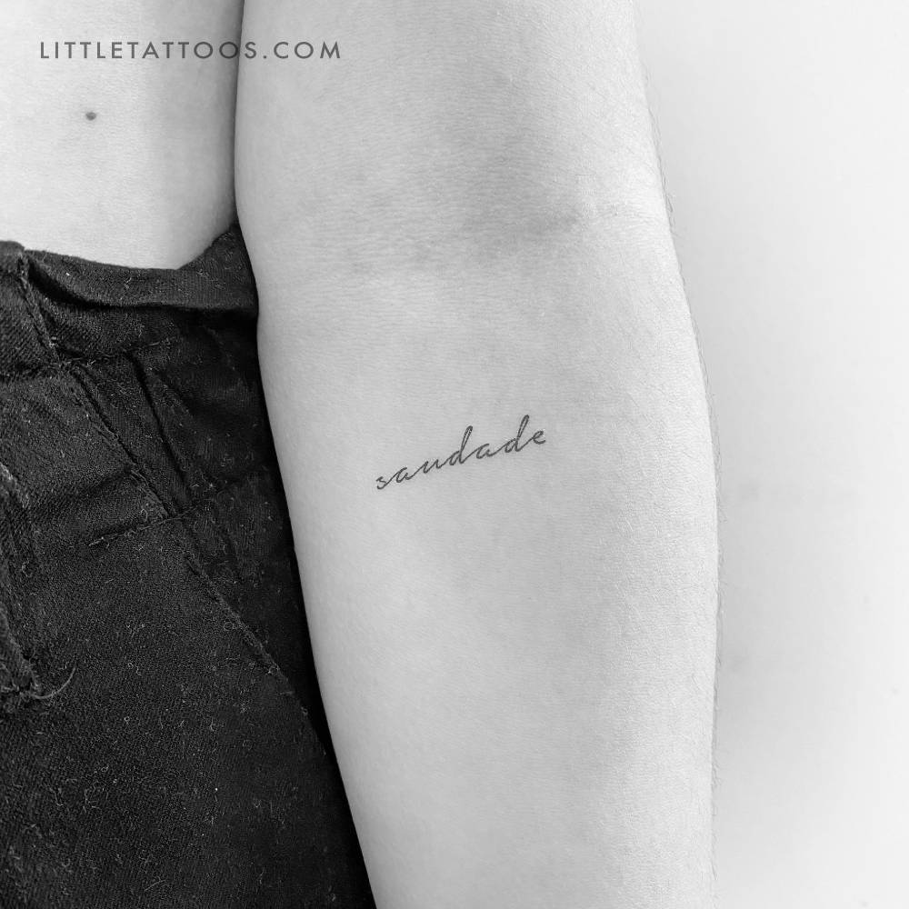 Handwritten font word "saudade" temporary tattoo.