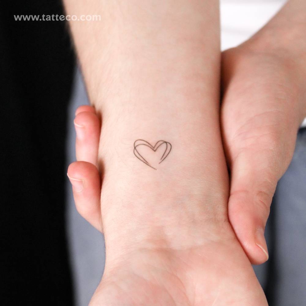 Small double heart semi-permanent tattoo.
