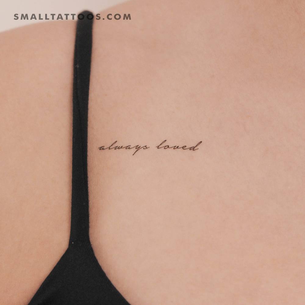 "Always loved" temporary lettering tattoo located on the collarbone.
