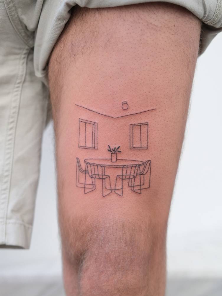 Table and chairs tattoo located on the thigh, fine line style.