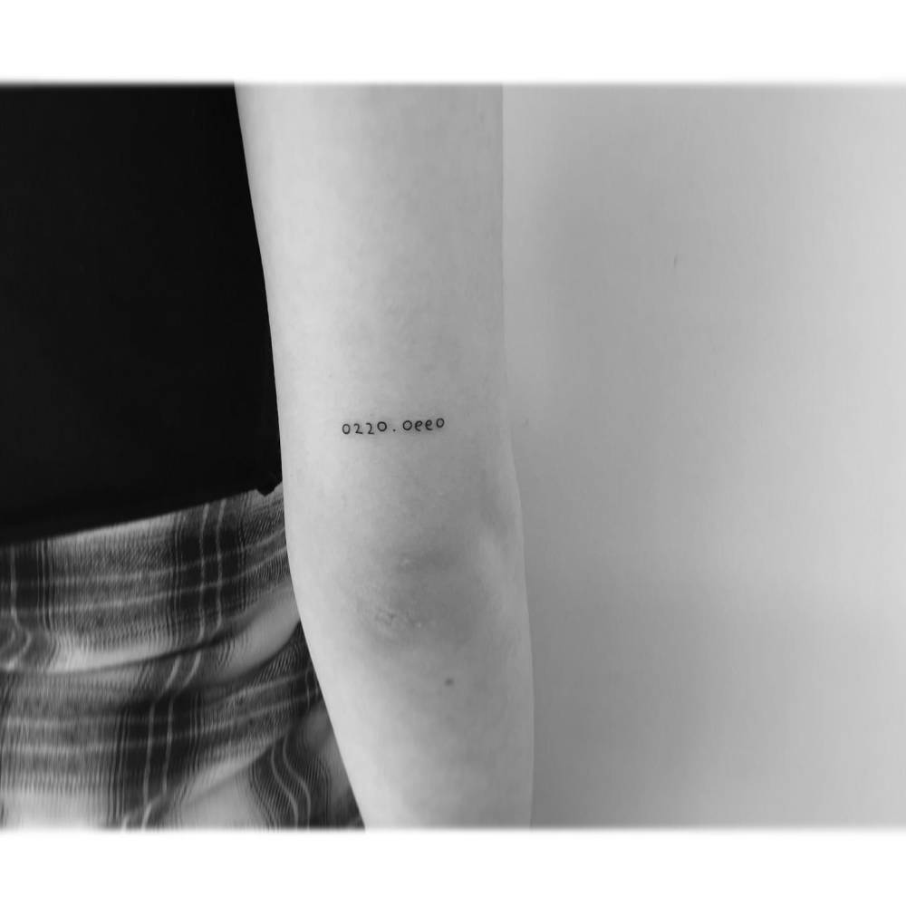 Numbers tattoo placed on the tricep.