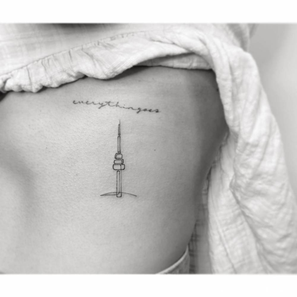 Continuous line N Seoul Tower tattoo located on the rib.