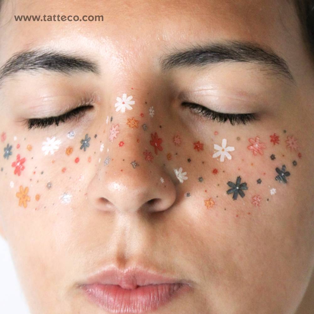 Flower freckles temporary tattoo located on the face.