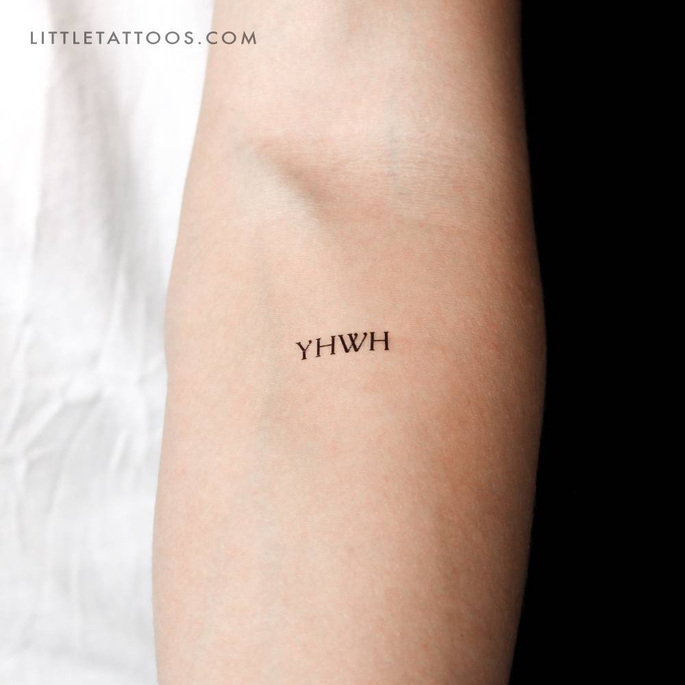 "YHWH" temporary tattoo placed on the inner forearm.