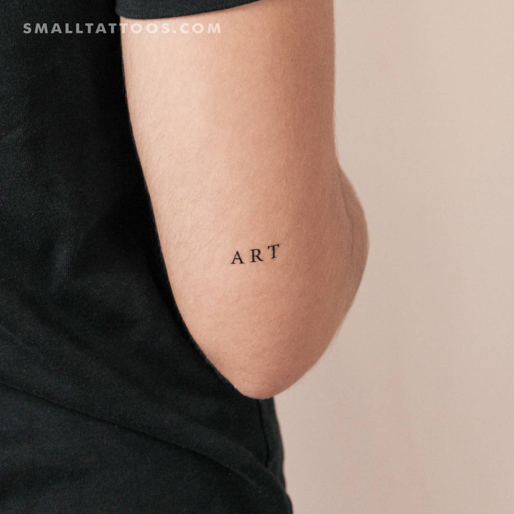 Serif font word 'art' temporary tattoo located on the tricep.