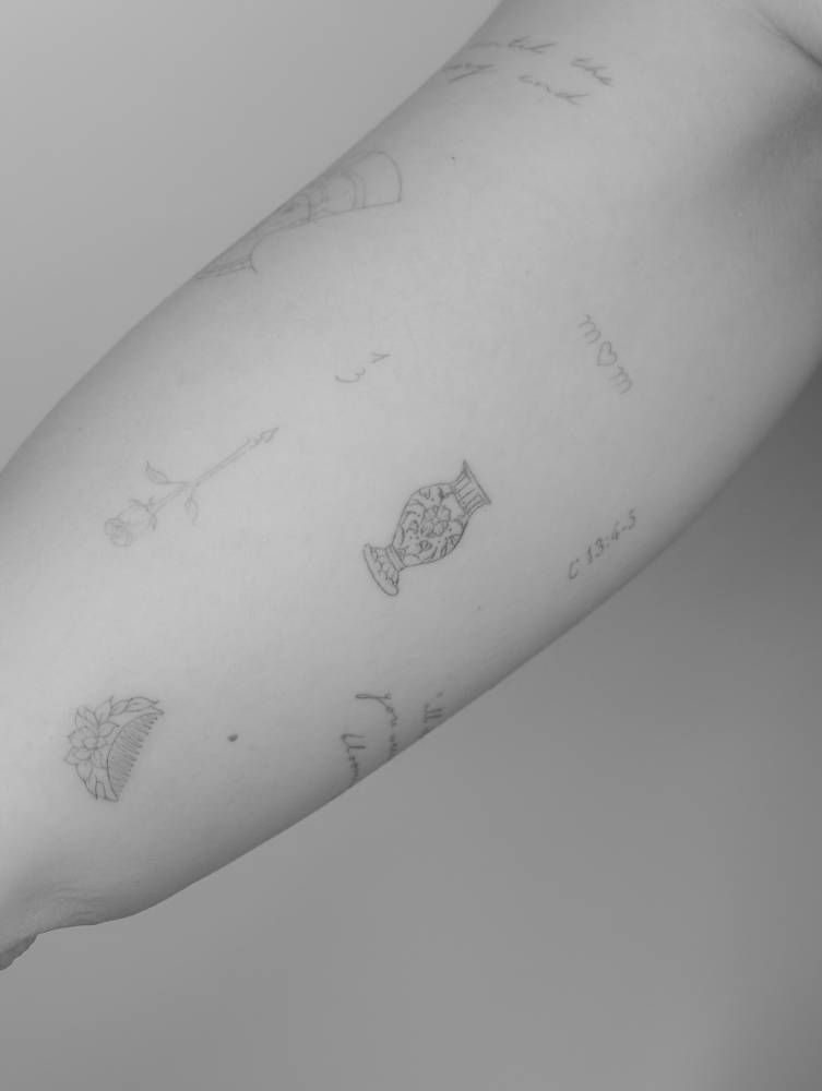 Vase tattoo in fine line style located on the inner arm.