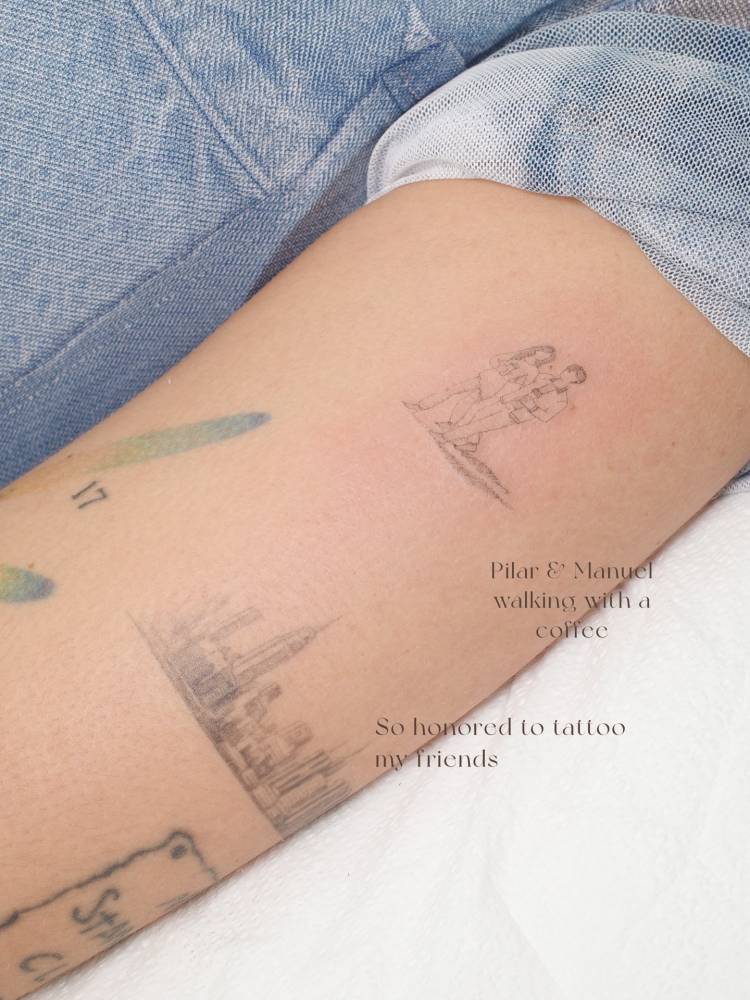 Lovers tattoo located on the upper arm, fine line style.