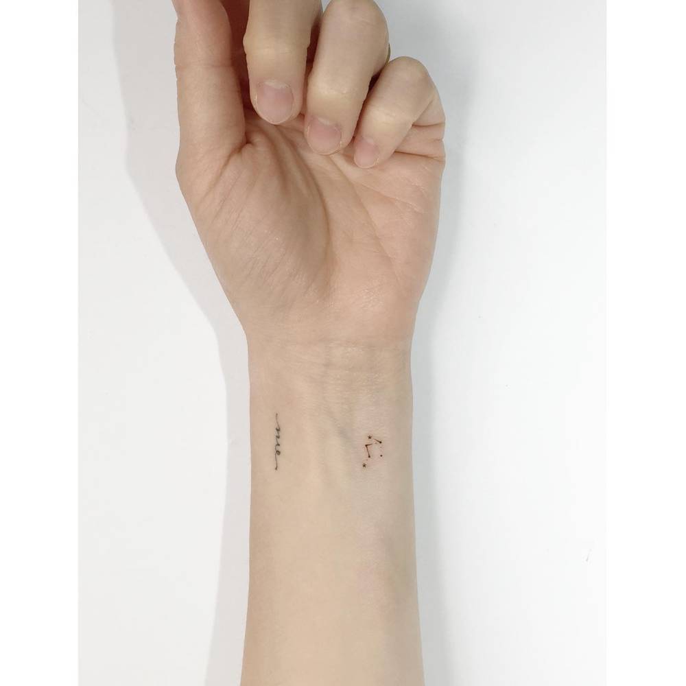 Tiny Libra constellation tattoo in minimalist style.