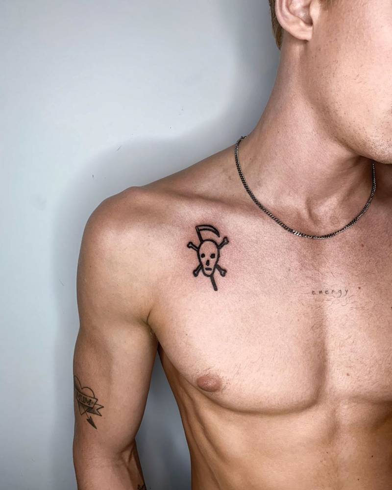 Jolly Roger tattoo located on Cody Simpson's collarbone.