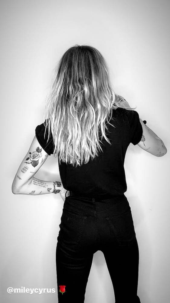 Rose tattoo located on MIley Cyrus' tricep.