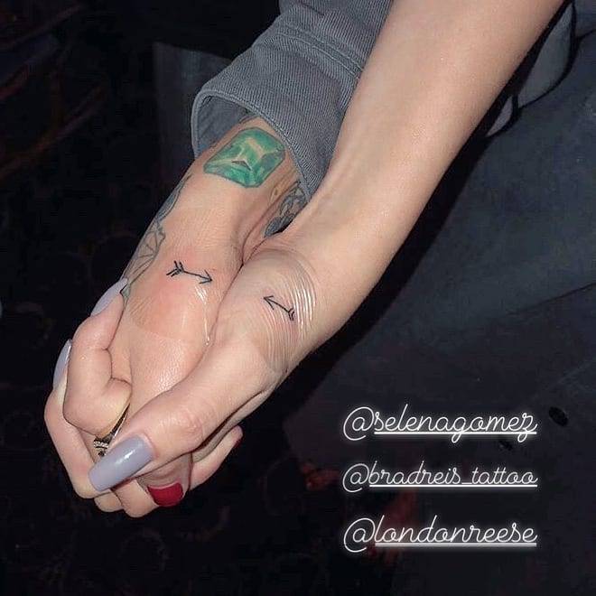 Matching arrow tattoos on Julia Michaels (done by London Reese) and Selena Gomez (tattooed by Brad Reis).